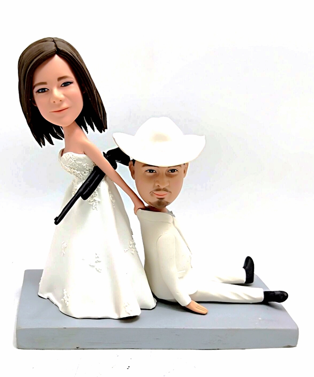 Custom wedding cake toppers Bride dragging groom Wedding Cake Toppers